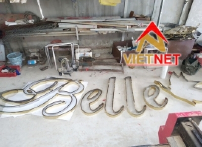Gia công khung chữ và logo inox vàng Belle